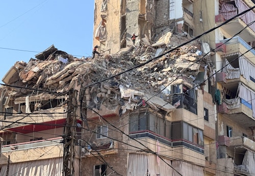 📷 In images: Rescue workers search through rubble following an Israeli airstrike in Beirut's southern suburbs